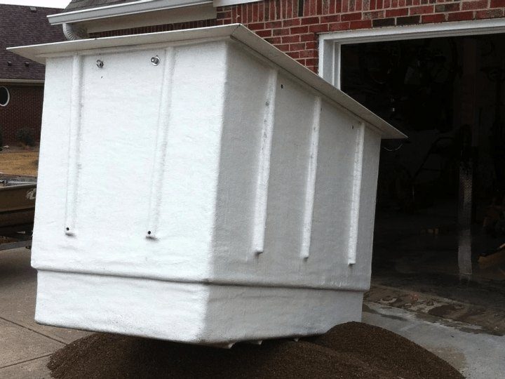 Storm shelter unit at a residential garage installation, Indiana