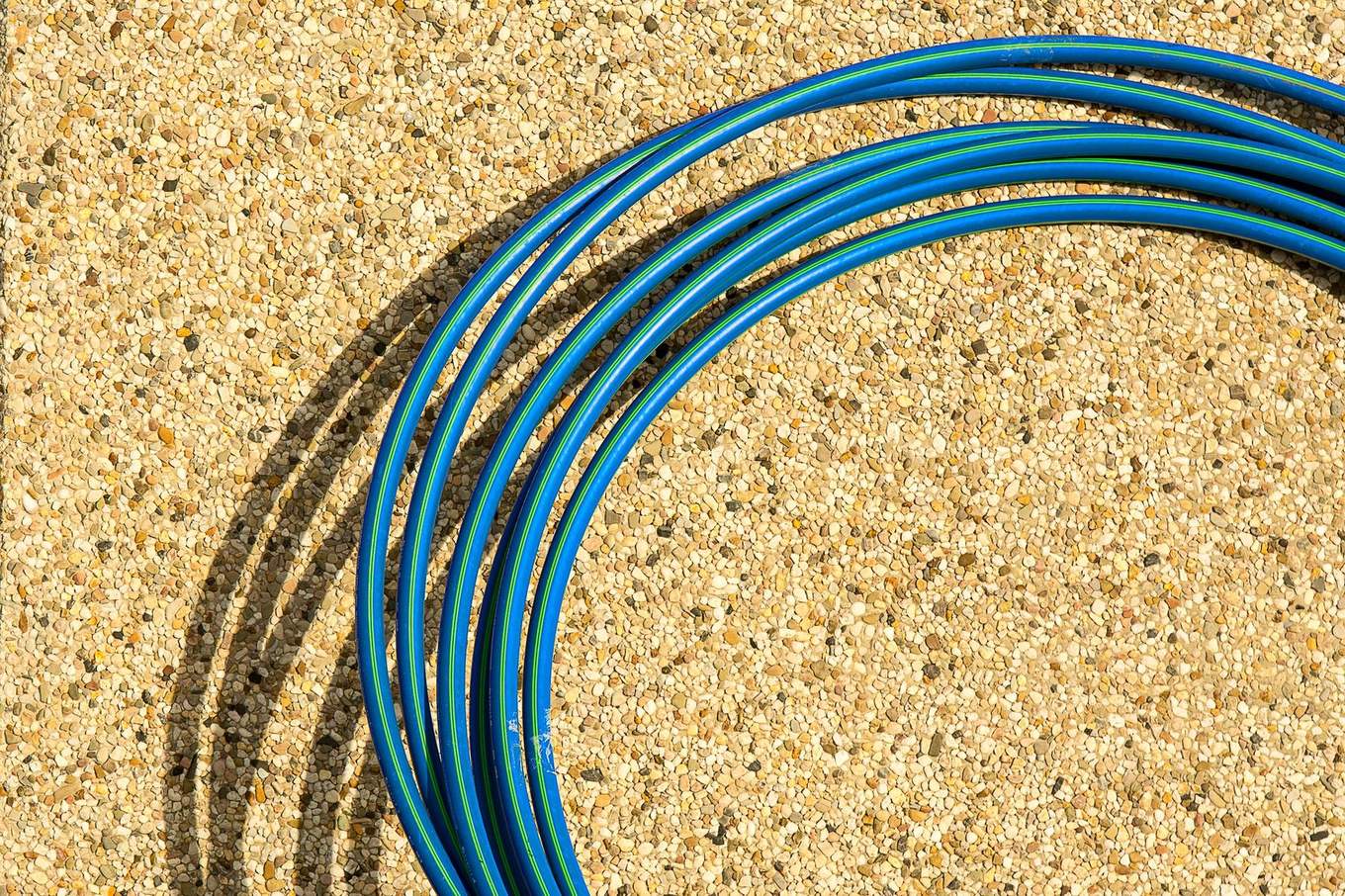 Coiled water service pipe staged on site before it goes in the ground